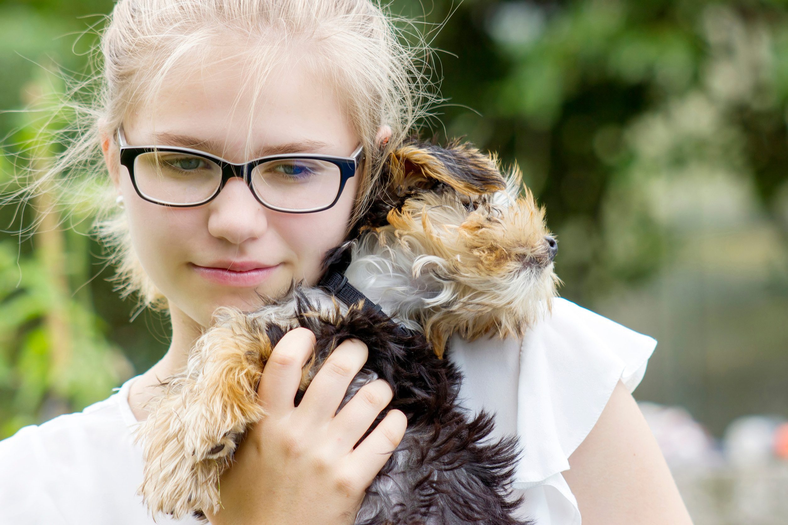 A girl holding her fluffy emotional support animal in Las Cruces, NM.
