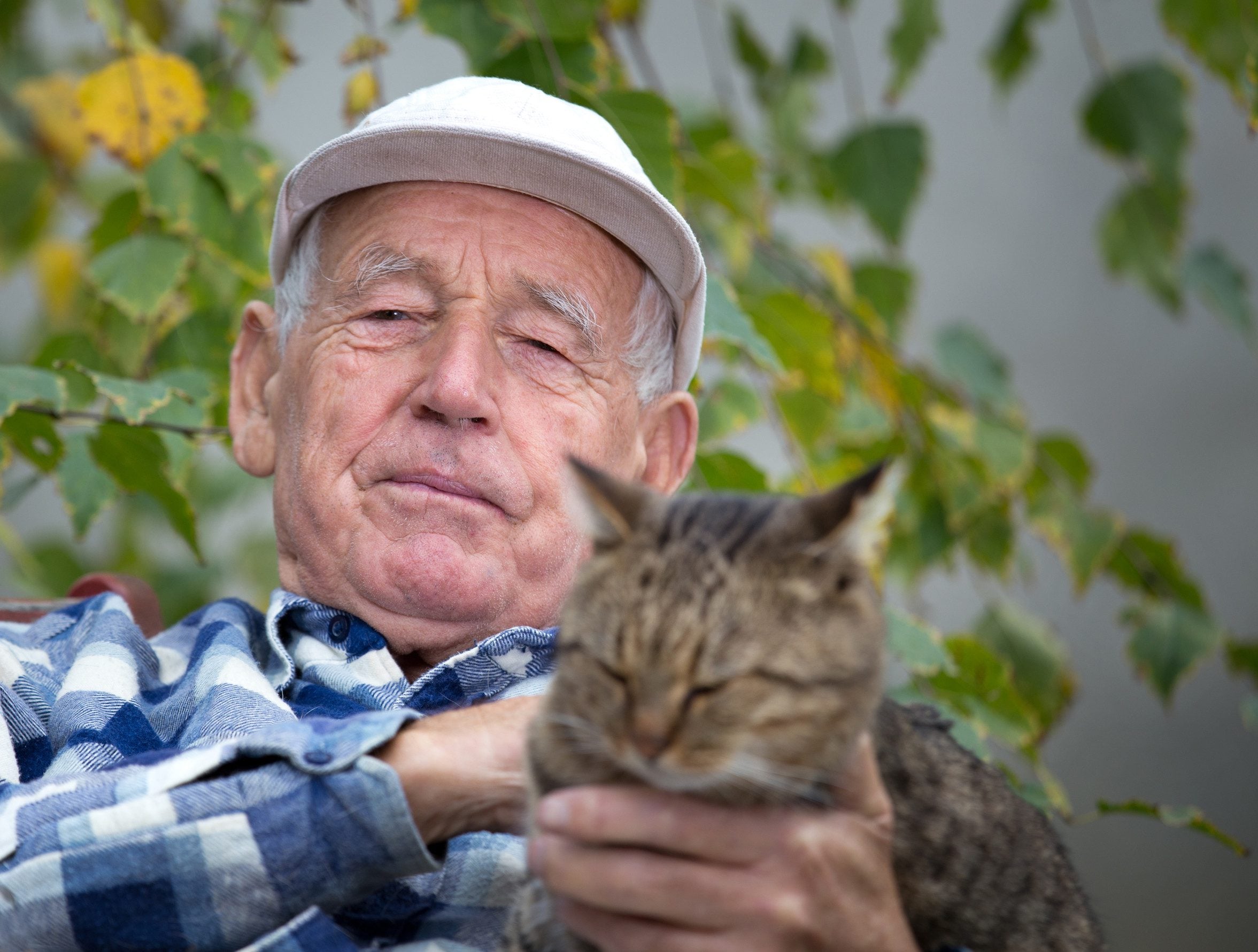 A man holding his emotional support animal in Provo, UT.